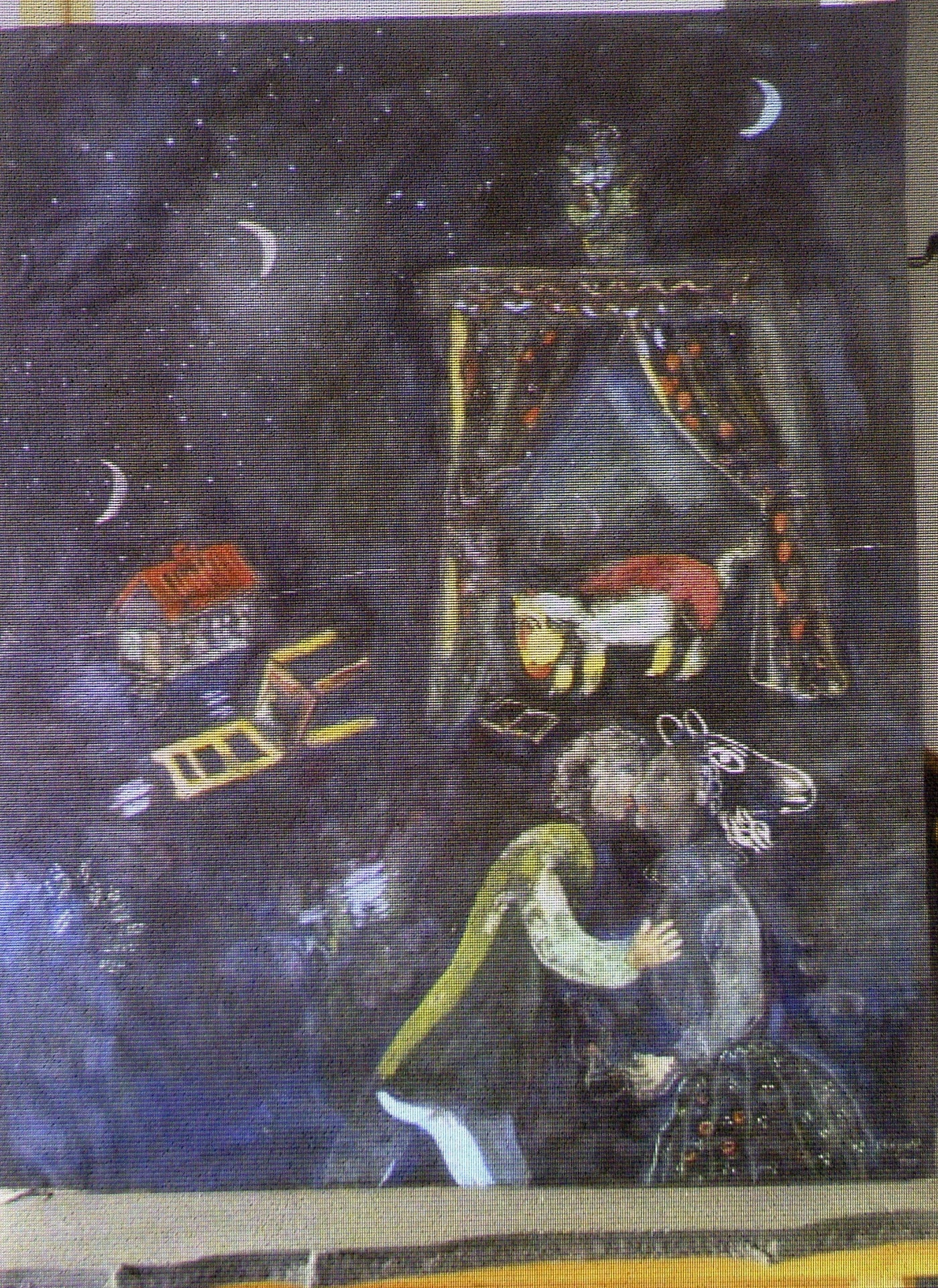 5.nov.2013 - Reprodução de uma pintura do artista Marc Chagall é mostrada durante uma entrevista coletiva em Augsburgo, no sul da Alemanha, sobre a descoberta de mais de 1.400 obras de arte no apartamento de Cornelius Gurlitt em Munique. O trabalho não datado, "Cena Alegórica", da metade dos anos 1920, foi roubada durante a Segunda Guerra Mundial por nazistas, de uma família judia chamada Blumsteins, que vivia em Riga - Christof Stache/AFP