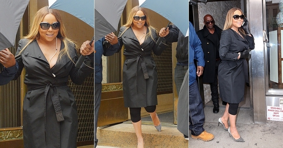 2.abr.2014 - Mariah Carey aparece com a silhueta mais cheia ao deixar um prédio comercial em Nova York. A cantora usava um trench coat preto e óculos escuros na ocasião
