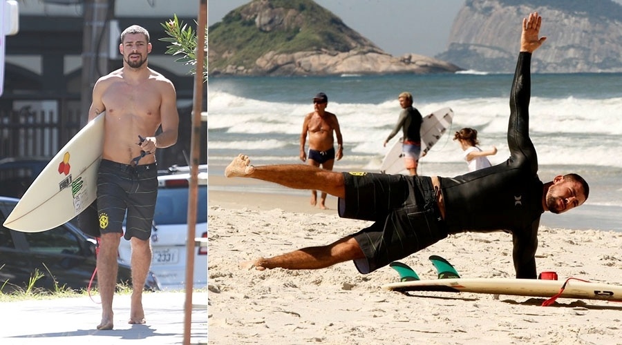 12.mai.2014 - Cauã Reymond faz alongamento antes de surfar na praia da Barra, na zona oeste do Rio
