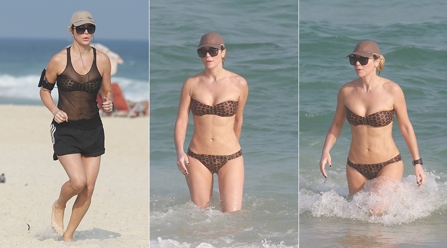 20.mai.2014 - Aos 46 anos, Christine Fernandes exibiu a boa forma na praia da Barra da Tijuca, zona oeste do Rio. Após correr na areia, a atriz se banhou no mar