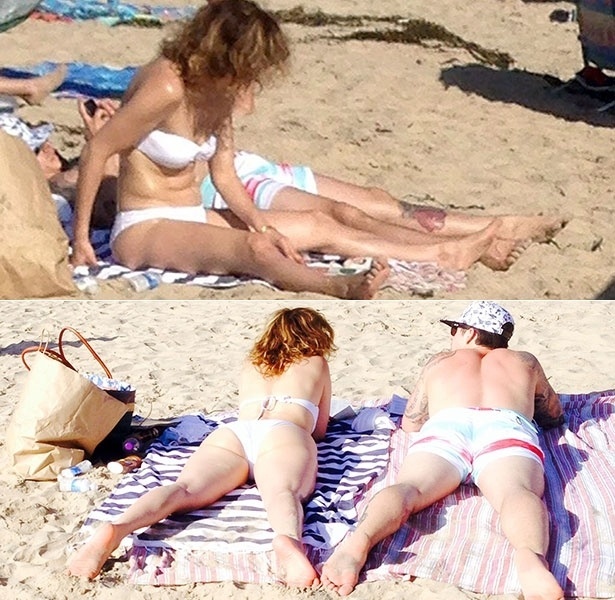 3.mai.2014 - Quase irreconhecível, com o cabelo ressecado, Jennifer Lopez vai à praia de Laguna Beach, na Califórnia, com o namorado, Casper Smart