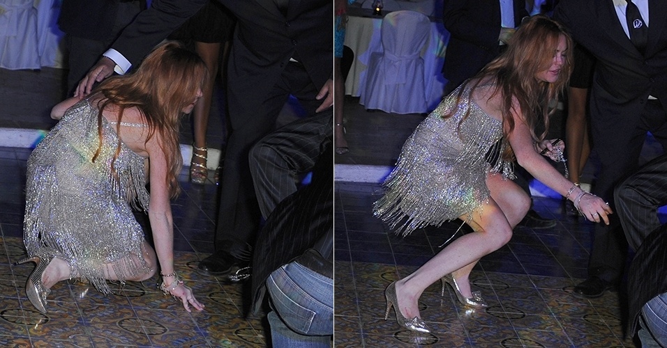 15.jul.2014 - De salto alto, Lindsay Lohan se desequilibrou ao cruzar o salão de um jantar de gala em Cannes. No chão, a atriz precisou da ajuda de um segurança para se levantar. Ela estava acompanhada no evento de seu namorado Patrik