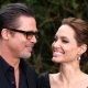 8.mai.2014 - Brad Pitt e Angelina Jolie sorriem ao chegar para exibição dos figurinos de "Malévola" no Palácio de Kensington, em Londres - Luke MacGregor/Reuters