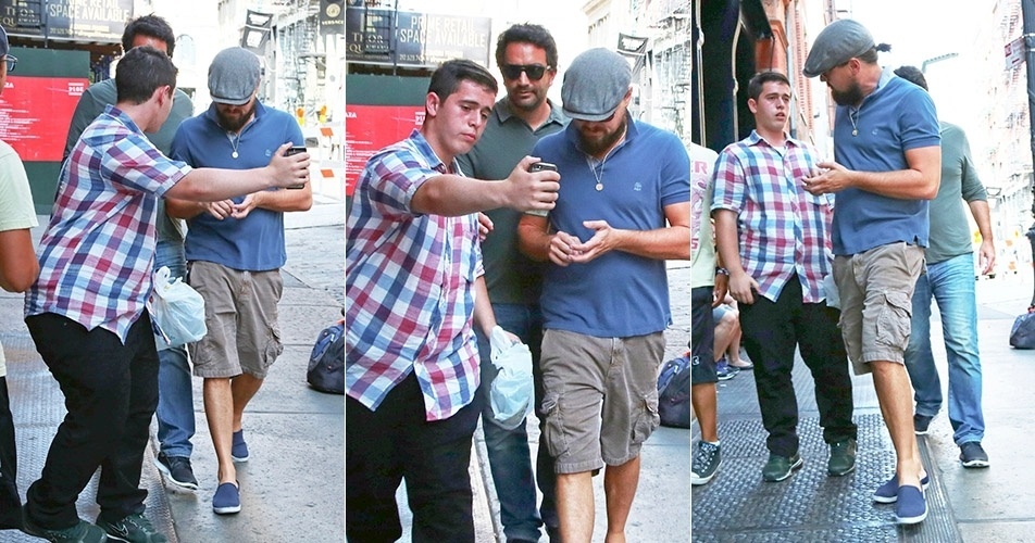 3.set.2014 - Leonardo DiCaprio fez de tudo para ignorar um fã que tentou fazer uma foto selfie com ele pelas ruas de Nova York, nos Estados Unidos. O ator, que estava de boina e óculos escuros, se irritou com as tentativas do jovem da fazer a foto mesmo com ele caminhando cabisbaixo e resolveu repreendê-lo