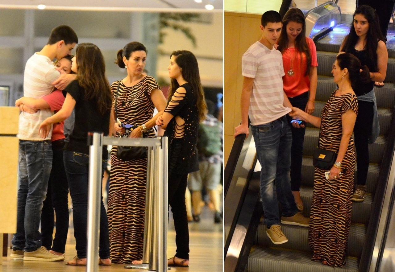 17.ago.2014 - Fátima Bernardes passeia com os filhos trigêmeos, Laura, Beatriz e Vinícius, este último acompanhado da namorada, Carolina, em um shopping da zona oeste do Rio de Janeiro, na noite desta sexta-feira - Henrique Oliveira/AgNews