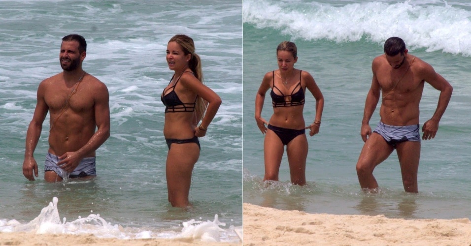 16.mar.2015- Henri Castelli aproveita segunda-feira de folga na praia com a namorada Diana Hernandez.. O ator exibiu a barriga de tanquinho ao deixar o mar