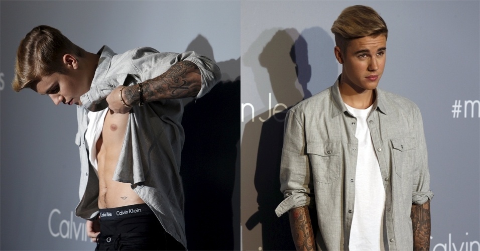 12.jun.2015 - Nesta sexta-feira, Justin Bieber levantou a camiseta e exibiu o abdômen em evento da Calvin Klein, em Hong Kong, na China