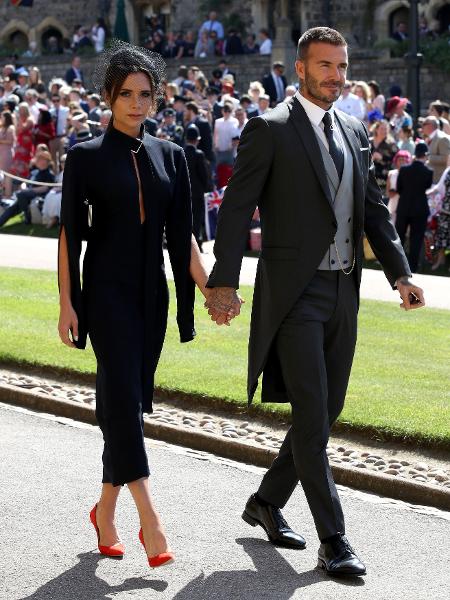 Victoria Beckham acompanhada do marido, David, no casamento real em 19 de maio - Getty Images
