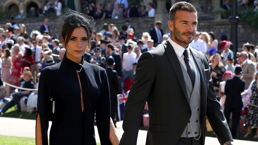 Victoria Beckham acompanhada do marido, David, no casamento real em 19 de maio. - Getty Images.