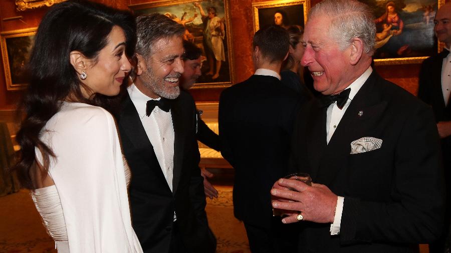 Amal Clooney, George Clooney e o príncipe Charles - Getty Images