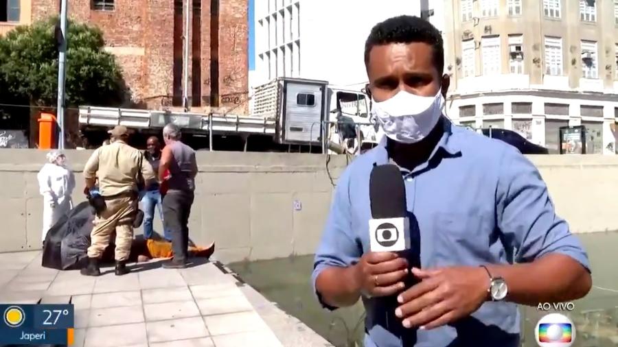 Repórter Rogério Coutinho, do jornal RJTV, ajuda em resgate de homem eletrocutado  - TV Globo/Reprodução