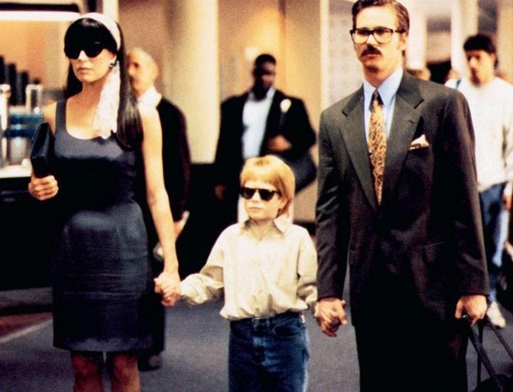 Kim Basinger, Val Kilmer e Zach English em cena de "O Grande assalto" (1993) - Divulgação