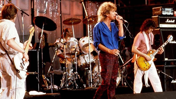 Phil Collins se apresenta com o Led Zeppelin nos Estados Unidos, no Live Aid, em 1985 - Getty Images - Getty Images