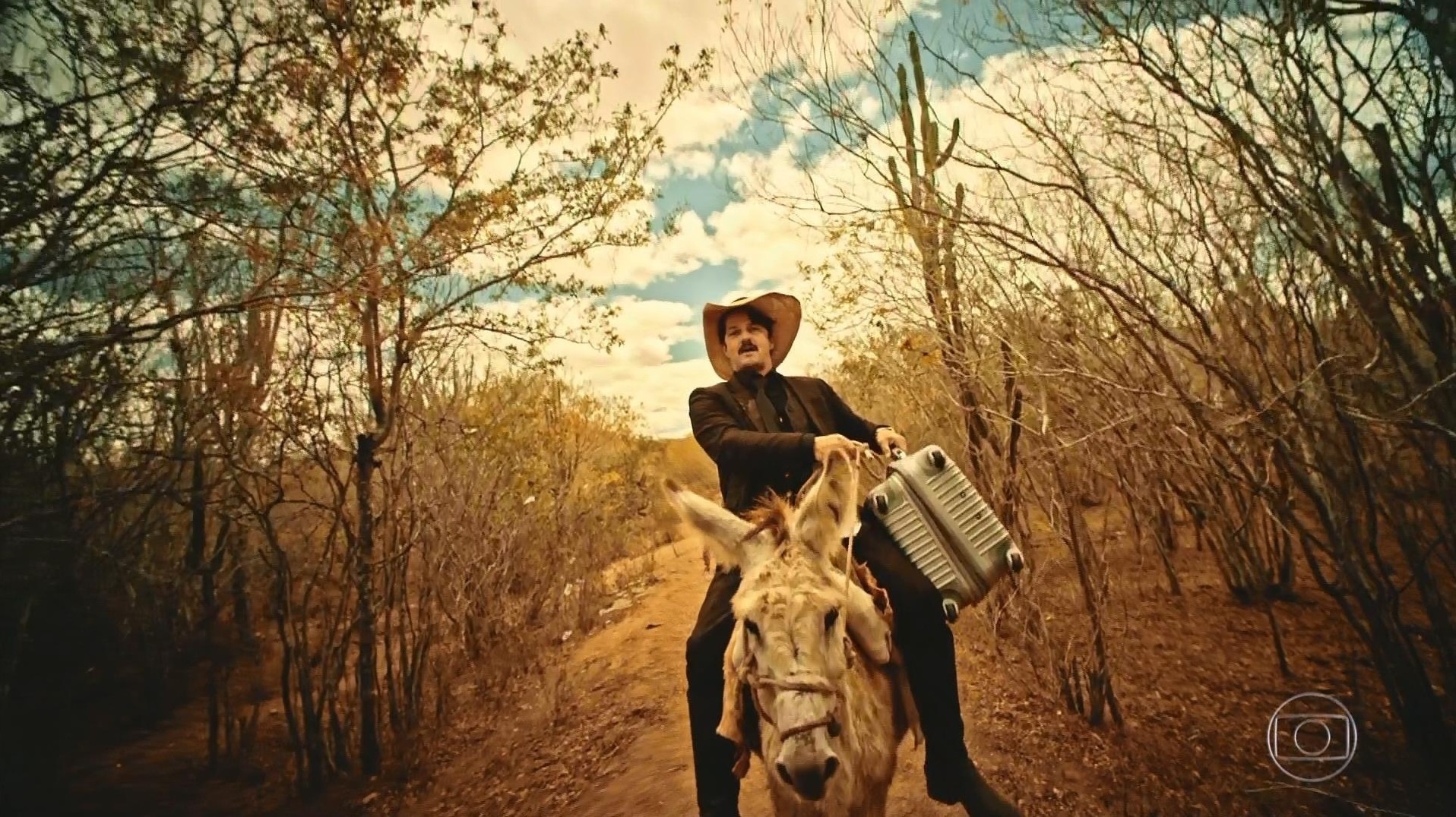 Carlos Eduardo é barrado por Bento e compra um burro para continuar fugindo com propina - Reprodução/TV Globo