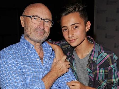 Phil Collins e o filho Nicholas, hoje com 17 anos - Larry Marano/Getty Images
