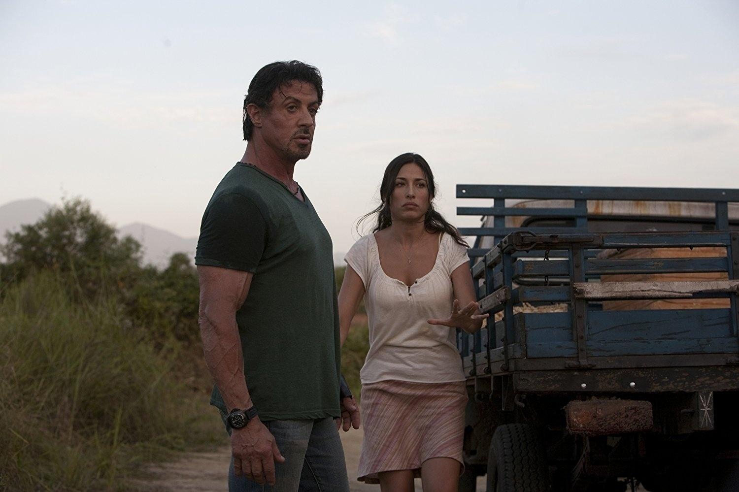 Sylvester Stallone e Giselle Itié em cena em "Os Mercenários" (2010) - Divulgação