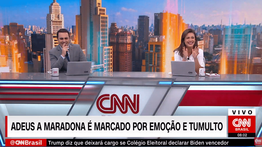 Rafael Colombo e Elisa Veeck não seguraram o riso no "CNN Novo Dia" de hoje - Reprodução / CNN