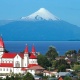Localizada às margens do lago Llanquihue, Puerto Varas tem a presença constante do vulcão Osorno no horizonte - Getty Images