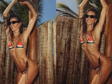 Izabel Goulart posa de biquíni na Bahia e curte banho de chuveirão