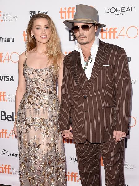 12.set.2015 - Amber Heard leva o marido Johnny Depp para a exibição de "The Danish Girl". A atriz interpreta Oola Paulson no drama, que é uma das apostas para o Oscar - Jason Merritt/Getty Images - Jason Merritt/Getty Images