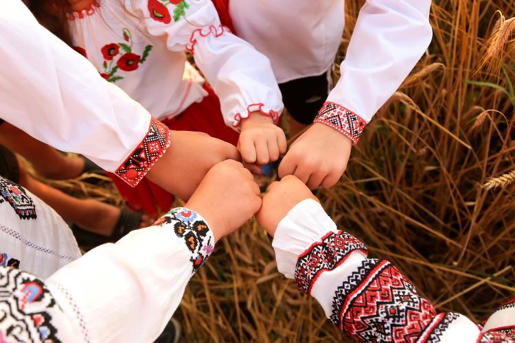 The hand gesture against Vyshyvanka is a symbol of national unity, also seen on the streets during Ukraine's Independence celebrations in August - Anna Koberska/Getty Images/iStockphoto - Anna Koberska/Getty Images/iStockphoto