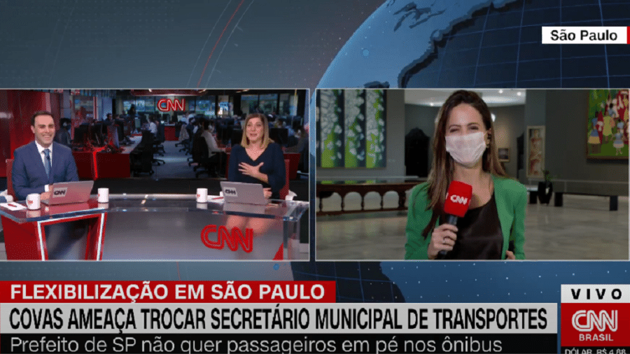 Âncora Rafael Colombo brinca com a mulher, a repórter Marcela Rahal, na CNN Brasil - Reprodução/CNN Brasil
