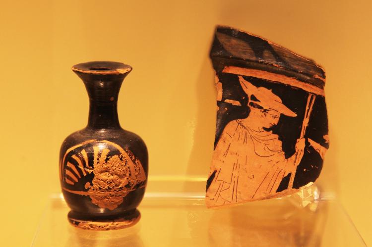 Small lekythos (from the first half of 4th Century B.C.) and a fragment of a red-figured amphora (from the 5th Century B.C.) on exhibit in the Athens International Airport in Athens, Greece. These artefacts were excavated while building Athens International Airport and on display in an airport museum. (Photo by Creative Touch Imaging Ltd./NurPhoto via Getty Images) - NurPhoto/NurPhoto via Getty Images - NurPhoto/NurPhoto via Getty Images