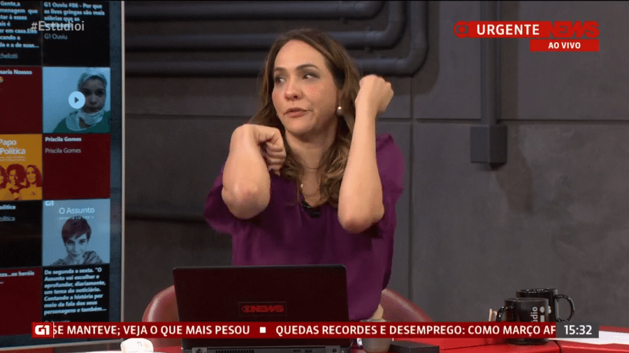 29.mai.2020 - Maria Beltrão, do "Estúdio i", faz mímica para explicar como abre portas em meio à pandemia de covid-19 - Reprodução/GloboNews