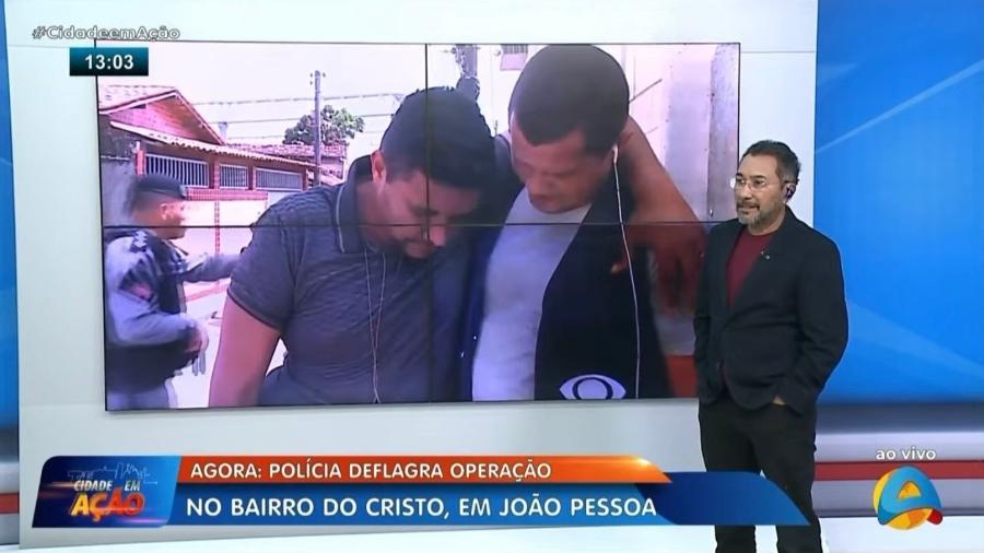 Betinho Nascimento se apoiando em colega de emissora durante mal-estar - Reprodução/ TV Arapuan