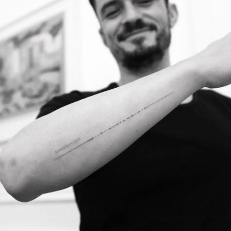 Orlando Bloom corrige tatuagem com homenagem ao filho - Reprodução/Instagram