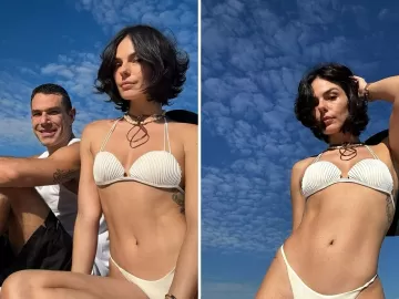 Em formato de concha, Isis Valverde posa de biquíni em praia em dia de sol