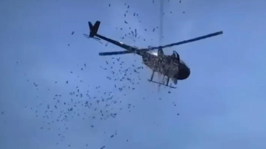 Helicóptero joga dinheiro em velório nos EUA Helicóptero joga dinheiro em velório nos EUA