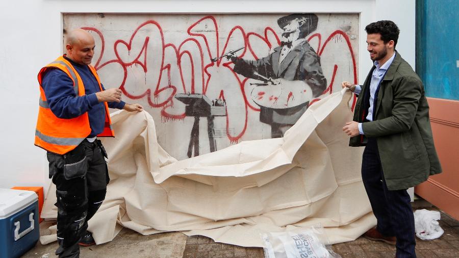 Mural oculto de Banksy é exibido em Notting Hill - REUTERS/Yara Nardi 