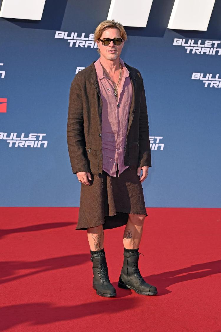 Brad Pitt with a skirt in a look with earth tones.  The look was created by designer Haans Nicholas Mott - Getty Images - Getty Images