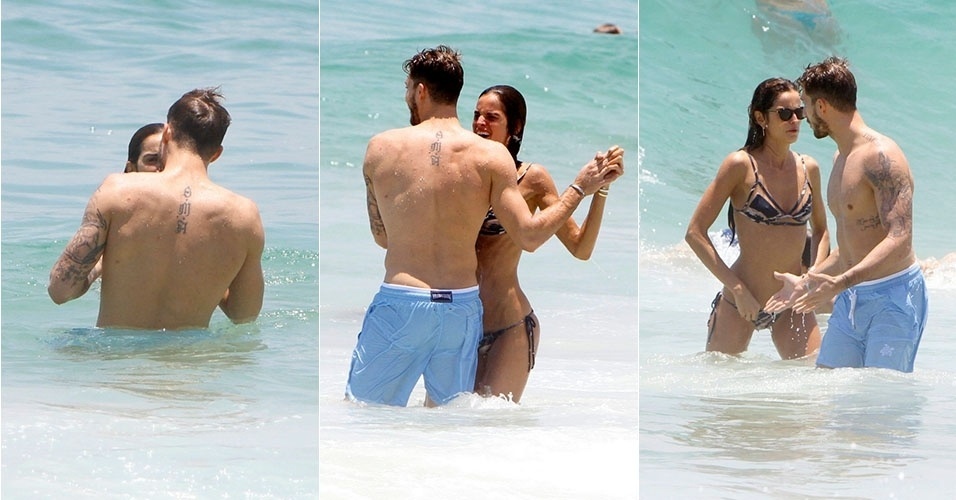 21.12.2015 - Na praia de Ipanema, no Rio, modelo Izabel Goulart aproveita para se refrescar no mar na companhia do namorado, o alemão Kevin Trapp - Gil Rodrigues/Brazil News