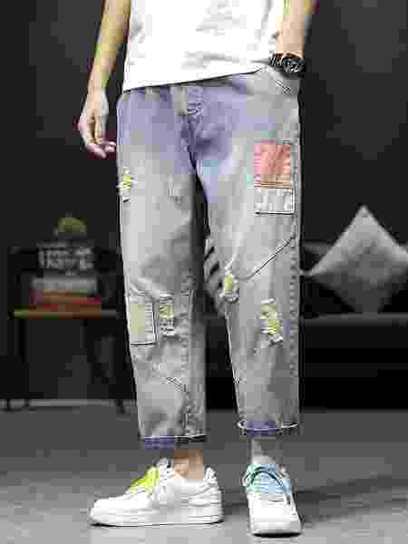 Sobreposição de tecidos pintados em calça jeans - Reprodução