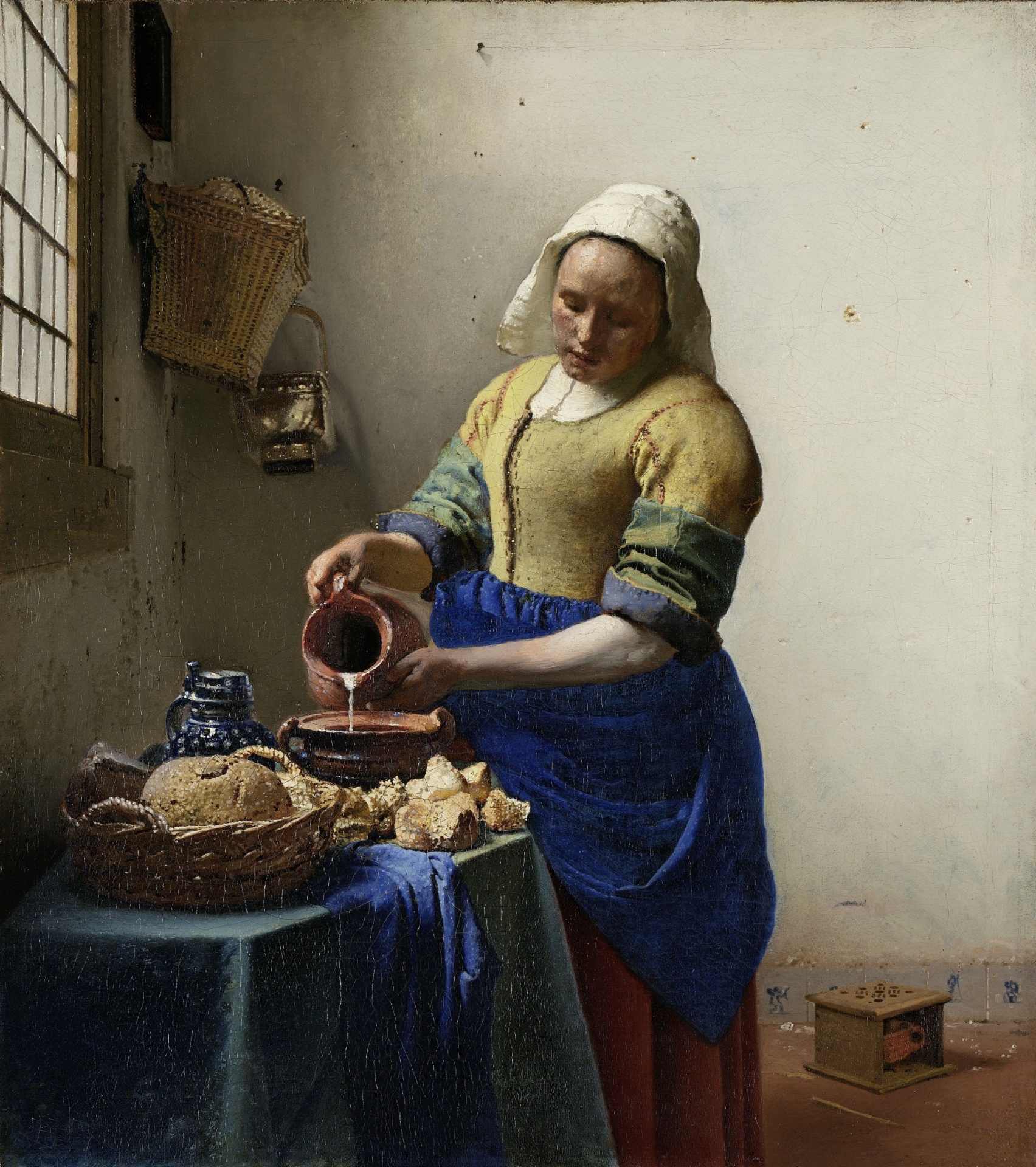 A obra prima "A Leiteira", de Johannes Vermeer também está em exposição no museu. O quadro mostra um artista que transformava atividades corriqueiras do dia a dia em pinturas impressionantes - Johannes Vermeer/Rijksmuseum