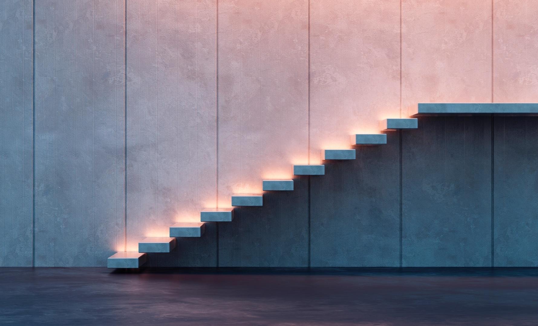 Moderna e com design arrojado, a escada não conta com guarda-corpo ou corrimão. Com degraus engastados na parede, a estrutura está em balanço e foi iluminada por balizadores que indicam o caminho - Getty Images