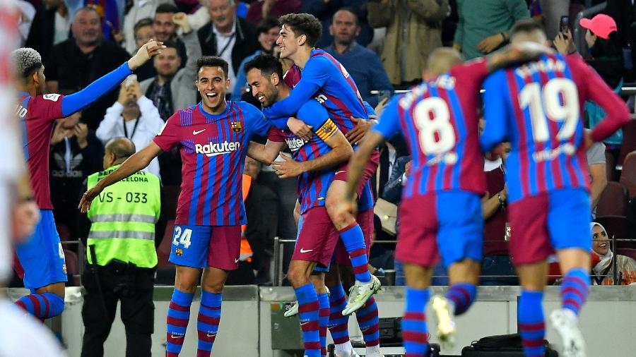 Jogadores do Barcelona comemoram gol sobre o Mallorca no Espanhol - Pau BARRENA / AFP
