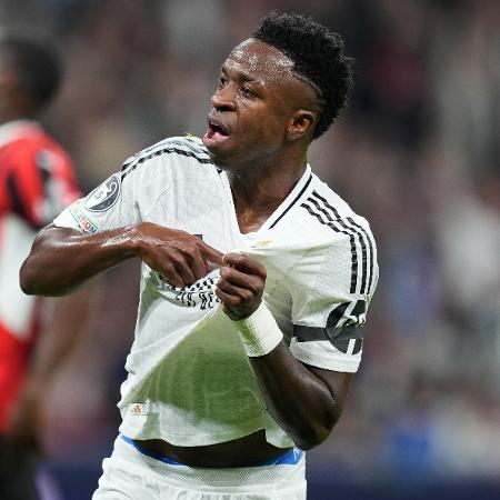 Vini Jr comemora gol marcado pelo Real Madrid contra o Milan pela Champions League Vini Jr comemora gol marcado pelo Real Madrid contra o Milan pela Champions League