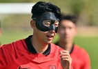 Risco de perder Copa? Entenda por que Son usa máscara nos treinos da Coreia - JUNG YEON-JE/AFP