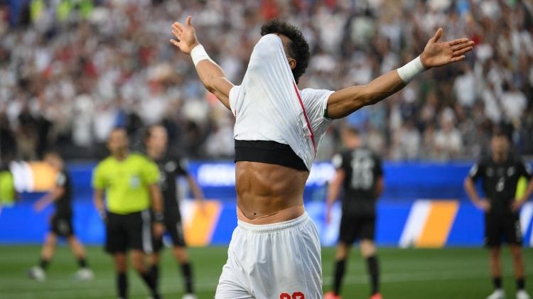 Rezaeian, do Irã, comemora gol contra a Nova Zelândia na Copa do Mundo Rezaeian, do Irã, comemora gol contra a Nova Zelândia na Copa do Mundo