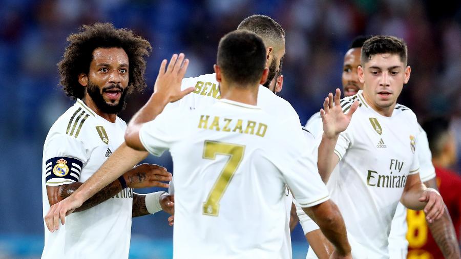 Marcelo comemora com os companheiros após marcar para o Real Madrid contra a Roma - Matteo Ciambelli/NurPhoto/Getty Images