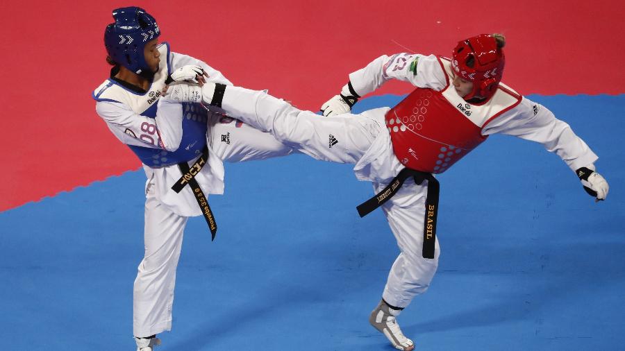Milena Titoneli (vermelho) levou o ouro no taekwondo: a transmissão da Record mostrou as fases preliminares - Susana Vera/Reuters