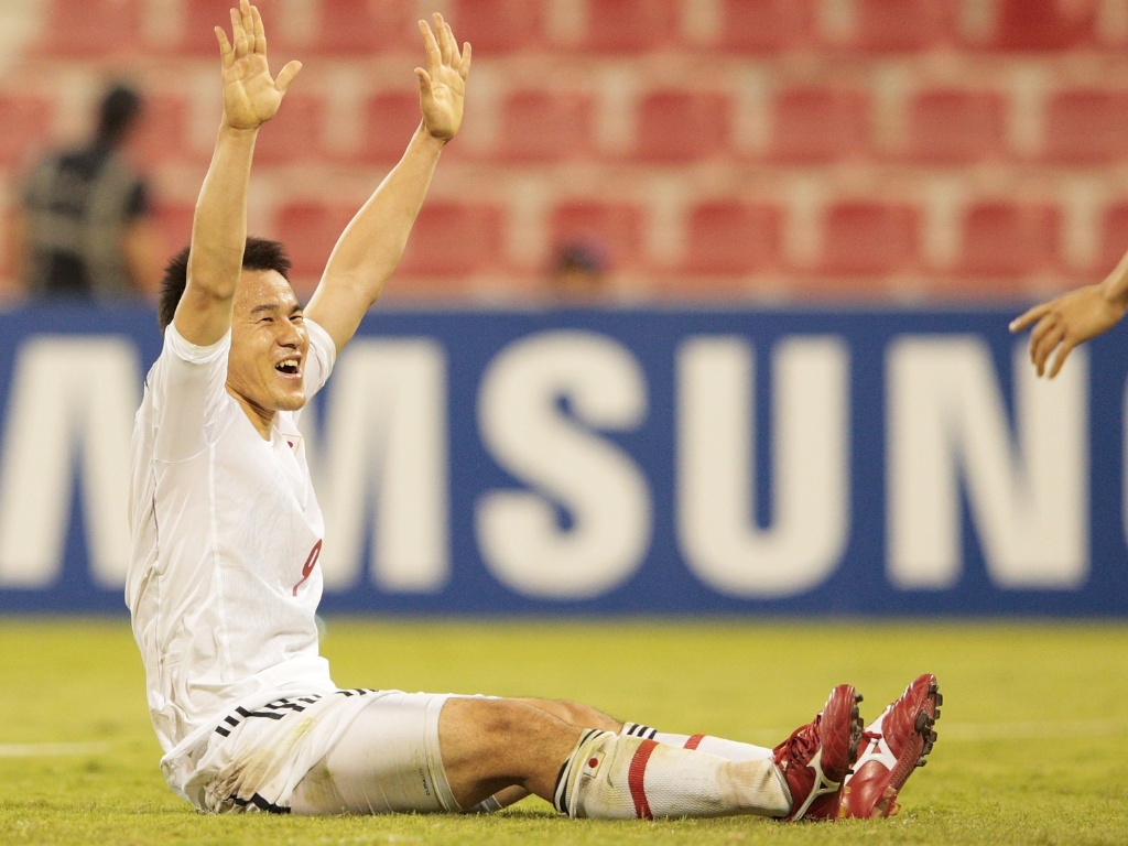 11.jun.2013 - Shinji Okazaki comemora após marcar o gol da vitória por 1 a 0 do Japão sobre o Iraque
