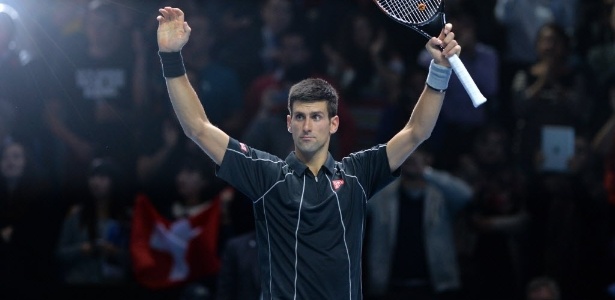 Novak Djokovic comemora após vencer Federer nas Finais da ATP - AFP PHOTO / BEN STANSALL