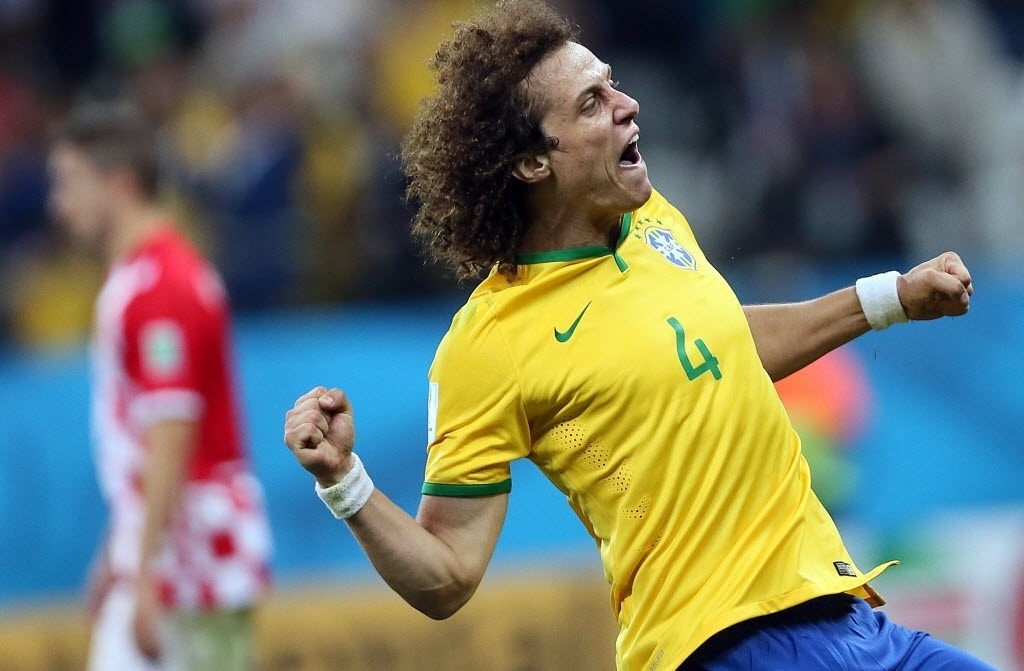 12.jun.2014 - David Luiz não esconde a alegria após Brasil marcar contra a Croácia. A estreia na Copa foi com vitória, de virada, por 3 a 1