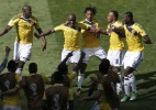 Ex-palmeirense, Armero celebra versatilidade e gol na estreia da Copa - AFP PHOTO / ADRIAN DENNIS