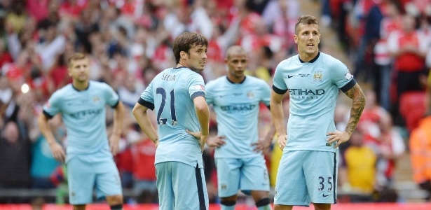 Jogadores do Manchester City durante partida do Campeonato Inglês  - EFE/EPA/ANDY RAIN
