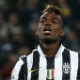 Pogba se lamenta em jogo da Juventus contra a Fiorentina - AFP PHOTO / MARCO BERTORELLO